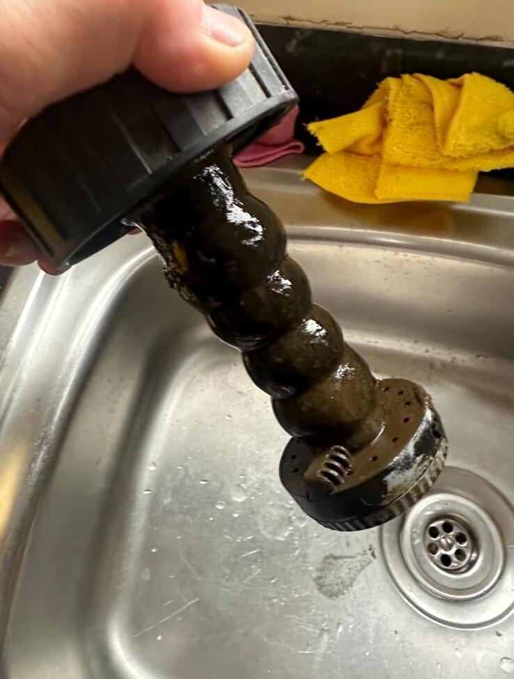 Heavily sludged magnetic filter element removed from a central heating system